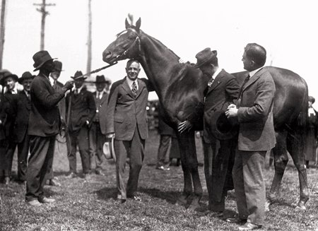 A group of men standing next to a horse
AI-generated content may be incorrect.